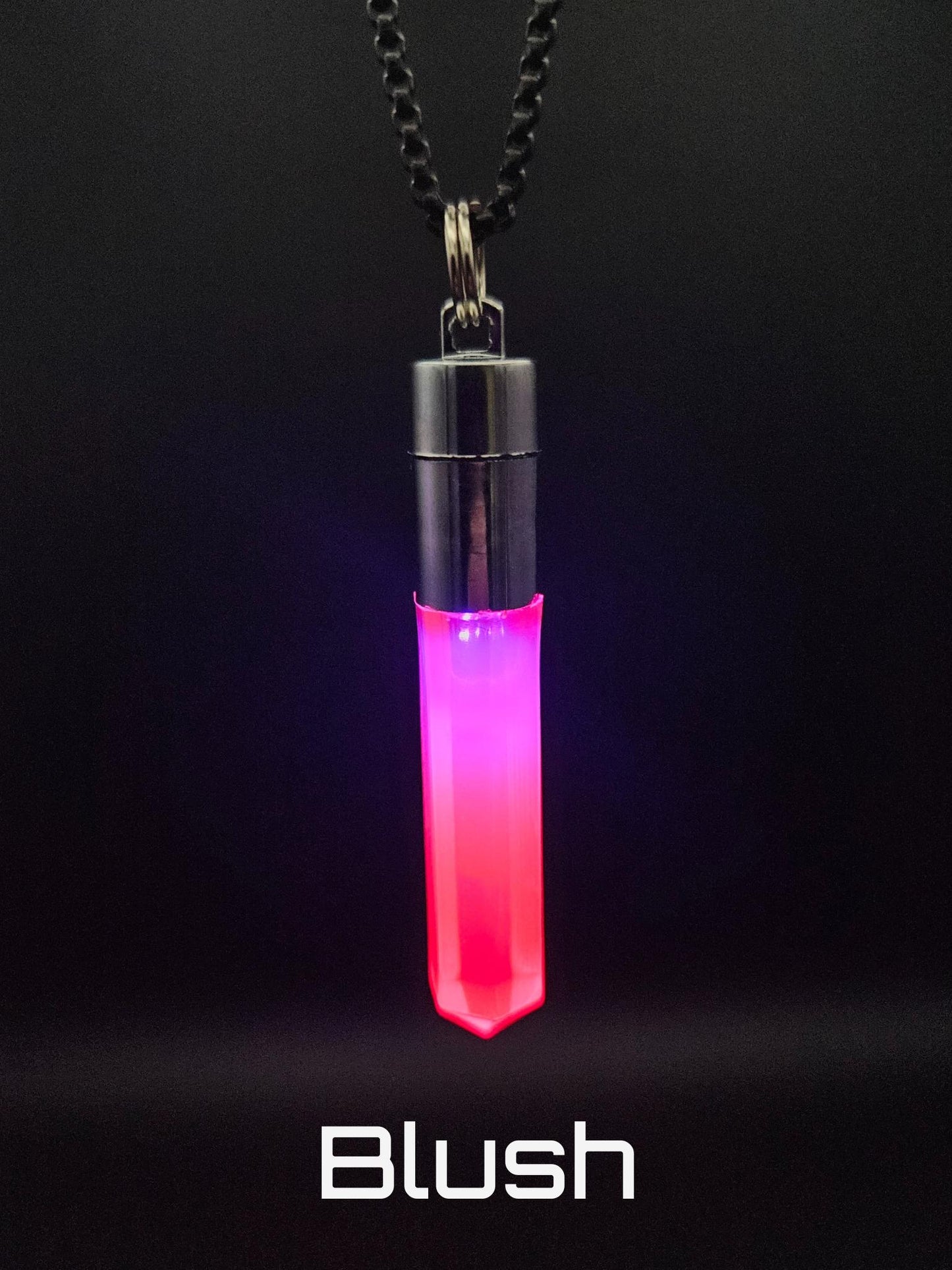 Glo Nova “Blush” LED light-up pendant necklace glowing pink and red—perfect for raves, cosplay, music festivals, and bold self-expression.